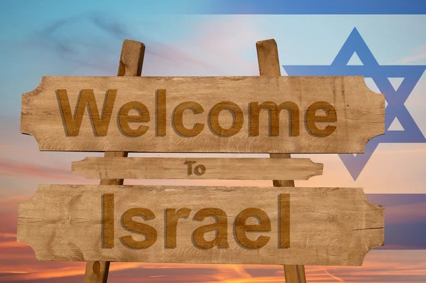 Bem-vindo a Israel cantar em fundo de madeira com misturando bandeira nacional — Fotografia de Stock