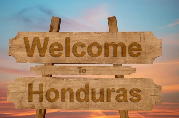 Välkommen till Honduras sjunga på trä bakgrund — Stockfoto