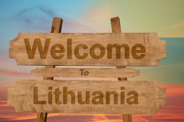 Litvanya ulusal bayrak harmanlama ile ahşap arka plan tabelada hoş geldiniz