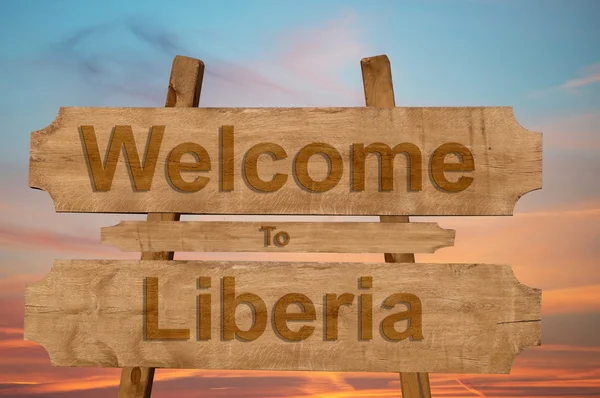 Bienvenido a Liberia signo sobre fondo de madera — Foto de Stock