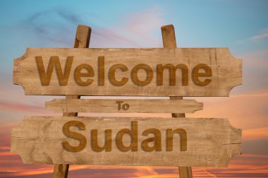Sudan işareti ahşap arka plan üzerinde hoş geldiniz