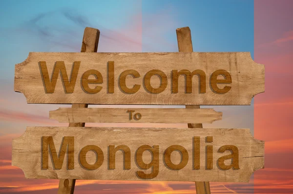 Benvenuti a segno Mongolia su sfondo di legno con miscelazione nationa — Foto Stock