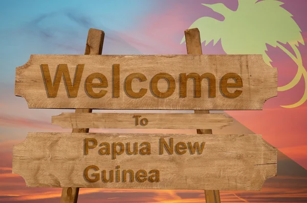 Bem-vindo ao sinal Papua-Nova Guiné em fundo de madeira com bandeira nacional de mistura — Fotografia de Stock