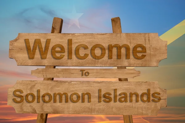 Bem-vindo ao sinal das Ilhas Salomão no fundo de madeira com bandeira nacional de mistura — Fotografia de Stock