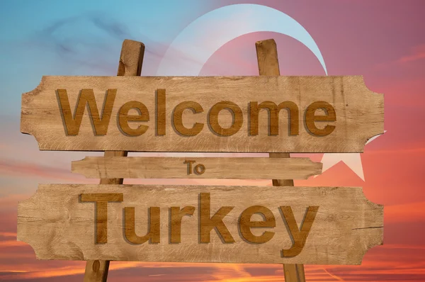 Welcome to Turkey sing on wood background with blending natio