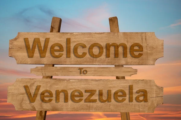 Bienvenidos a Venezuela cantan sobre fondo de madera — Foto de Stock