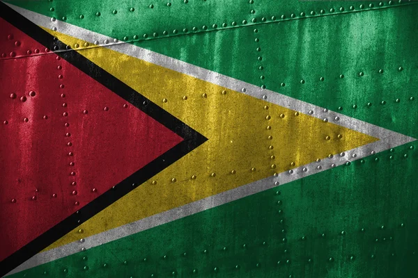 Fém texutre, vagy a háttér Guyanai zászló — Stock Fotó