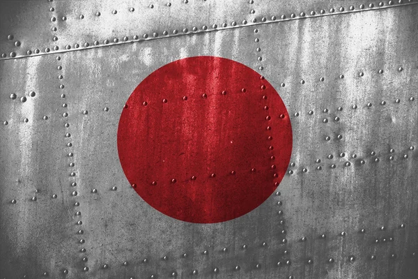 Текстура металла или фон с флагом Японии — стоковое фото