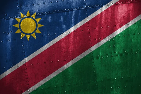 Texutre métallique ou fond avec drapeau namibien — Photo