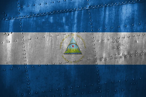 Metalltexutre oder Hintergrund mit Nicaragua-Flagge — Stockfoto