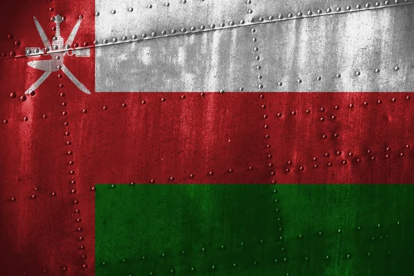 Texutre de metal o fondo con bandera de Omán — Foto de Stock