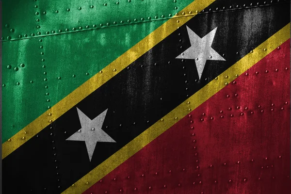 Metalltexutre oder Hintergrund mit Saint Kitts & Nevis Flagge — Stockfoto