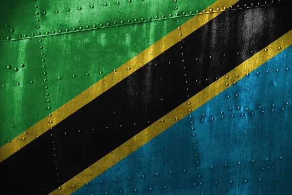 Texutre metallo o sfondo con bandiera Tanzania — Foto Stock