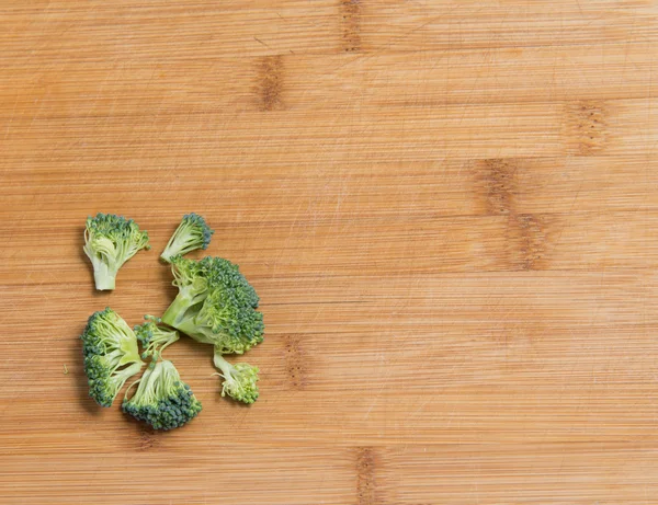 Fresh broccoli solated on a wooden background — Stock Photo, Image