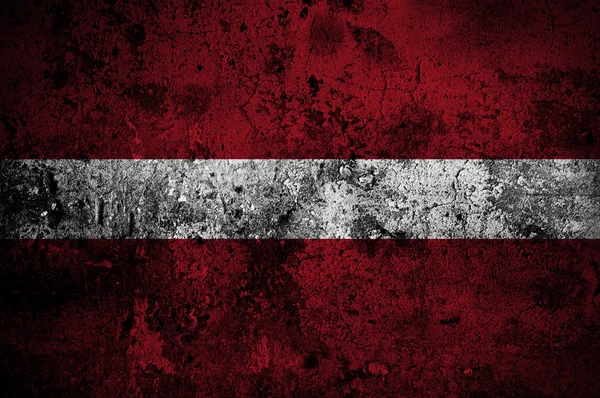 Latvias grungeflagg med hovedstad i Riga – stockfoto