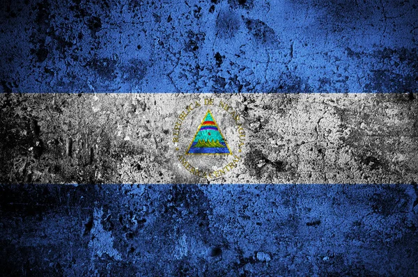 Grunge Vlajka Nikaraguy s kapitálem v Managua — Stock fotografie
