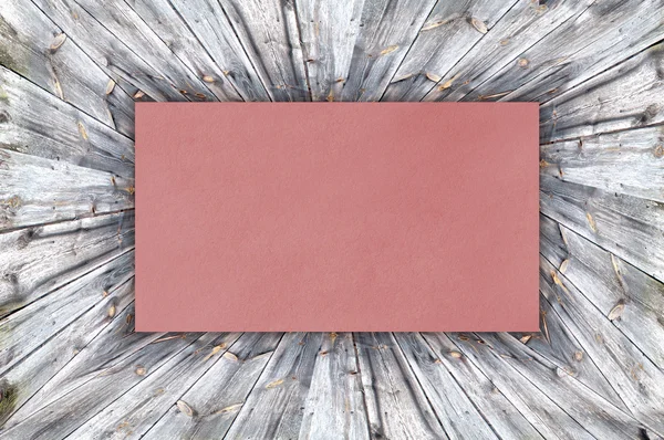 Red Paper on wood background or texture — Stock Photo, Image