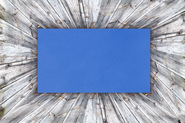 Blue Paper on wood background or texture — Stock Photo, Image
