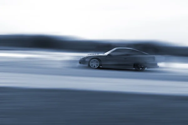 Sehr schnelles Fahren, Bewegungsunschärfe Drift — Stockfoto