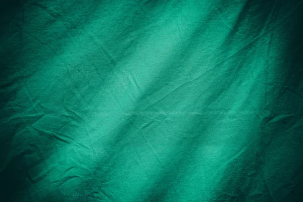 Зеленый текстильный фон или текстура — стоковое фото