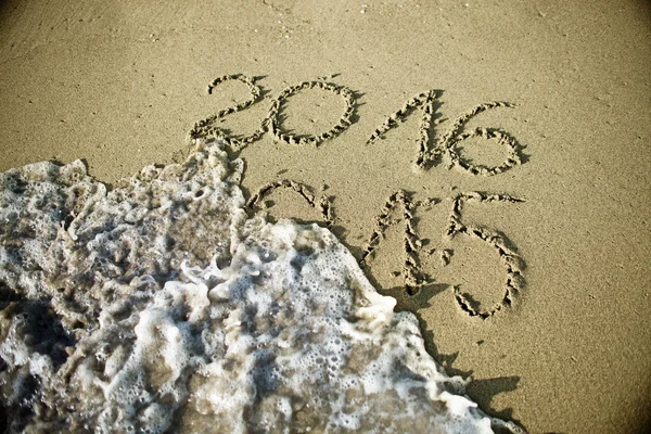 Happy New Year 2016 replace 2015 concept on the sea beach — Stock Photo, Image