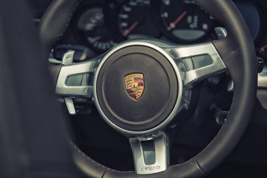 Sleza, Poland, August 15, 2015: Close up on Porsche 911 carrera s car steering wheel and cockpit  Motorclassic show on August 15, 2015 in the Poland