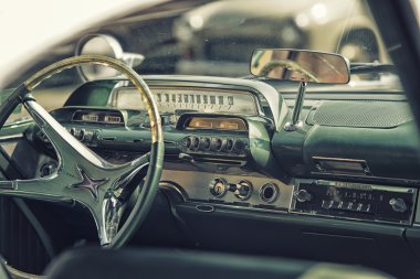 Sleza, Poland, August 15, 2015: Close up on old vintage car steering wheel and cockpit on  Motorclassic show on August 15, 2015 in the Poland