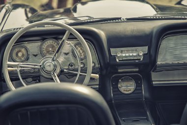 Sleza, Poland, August 15, 2015: Close up on old vintage car steering wheel and cockpit on  Motorclassic show on August 15, 2015 in the Poland