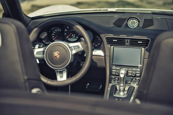 Sleza, Poland, August 15, 2015: Close up on Porsche 911 carrera s car steering wheel and cockpit  Motorclassic show on August 15, 2015 in the Poland