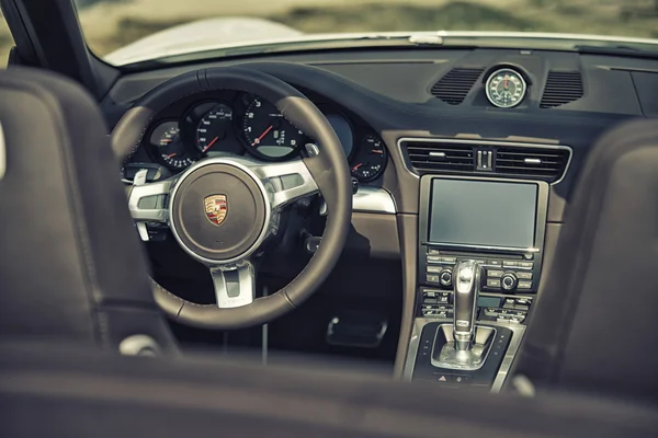 Sleza, Poland, August 15, 2015: Close up on Porsche 911 carrera s car steering wheel and cockpit  Motorclassic show on August 15, 2015 in the Poland 로열티 프리 스톡 사진