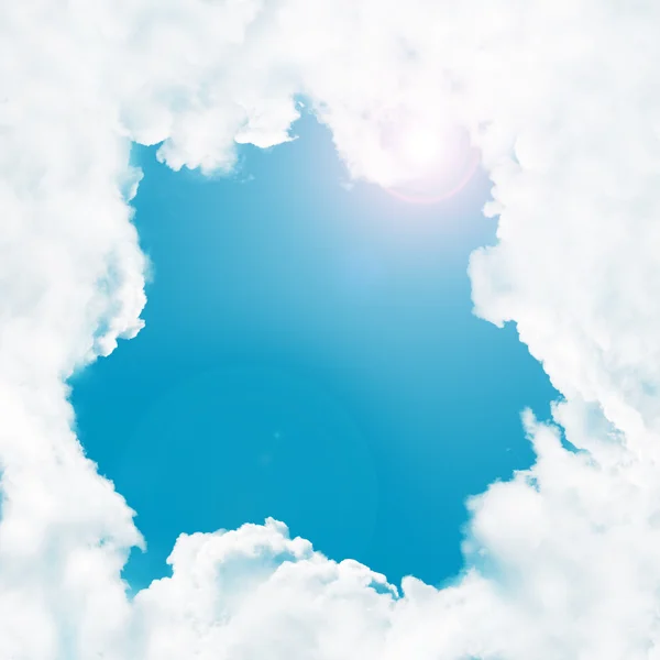Quadro - nuvens brancas no céu azul e sol — Fotografia de Stock