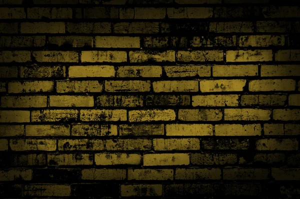 Donker gele grunge muur achtergrond of textuur — Stockfoto