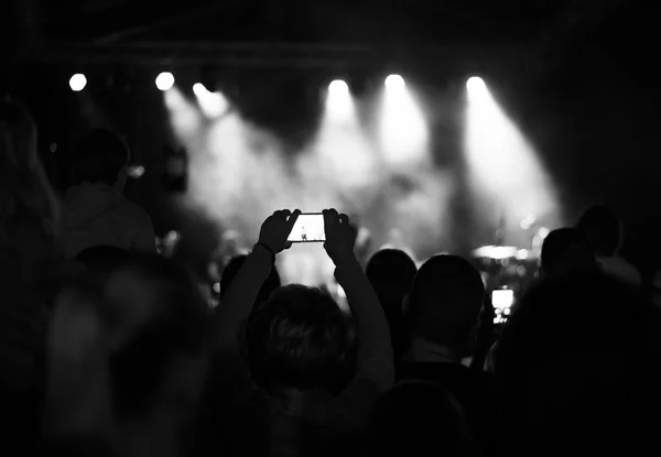 Supporters recording at concert, black and white, noise — Stock Photo, Image