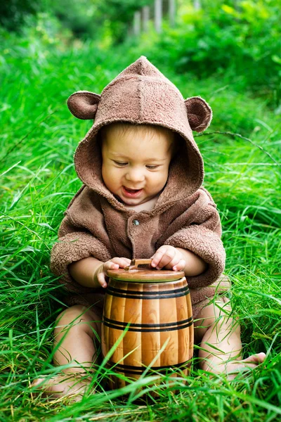 Baby  holding a jar of honey — Stock Photo, Image