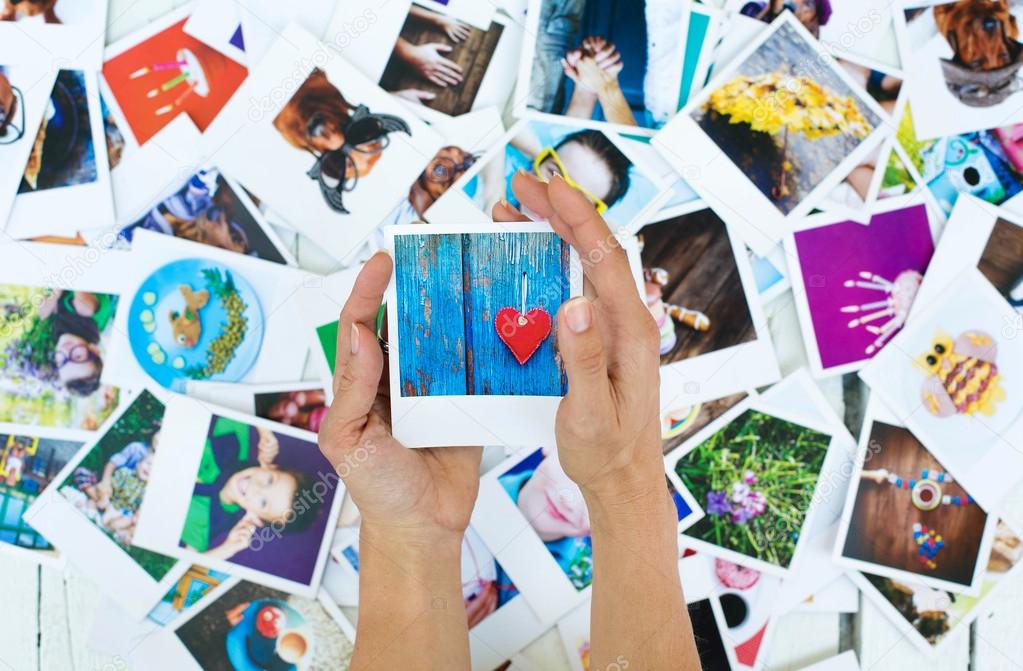 Set of polaroid photos in hands 