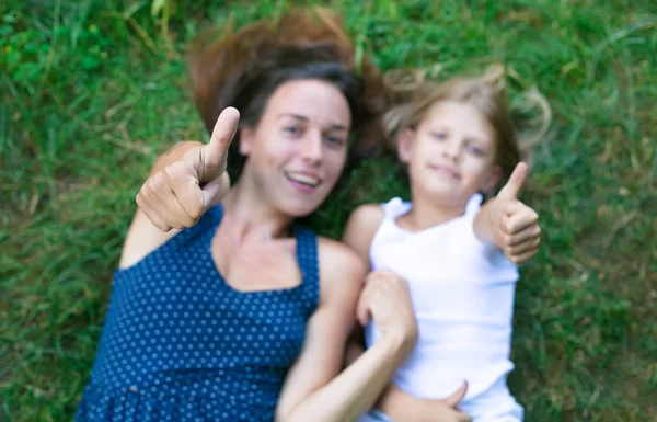 Two friends lying on the grass — Stock Photo, Image