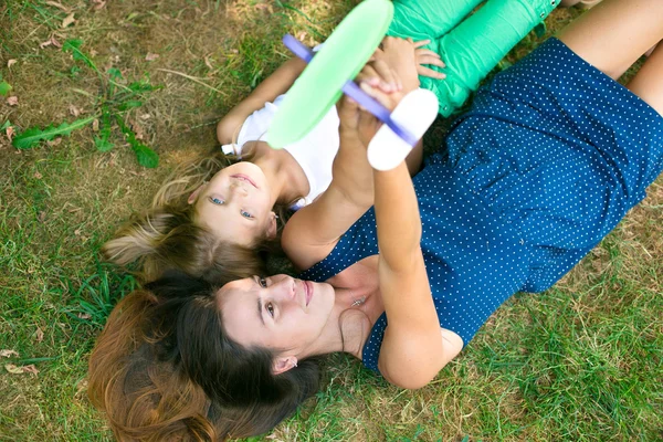 Two friends lying on the grass — Stock Photo, Image