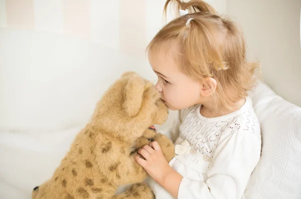 Girl playing with a toy — Stock Photo, Image