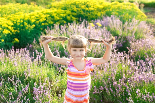 Little girl on green meadow — Stock Photo, Image