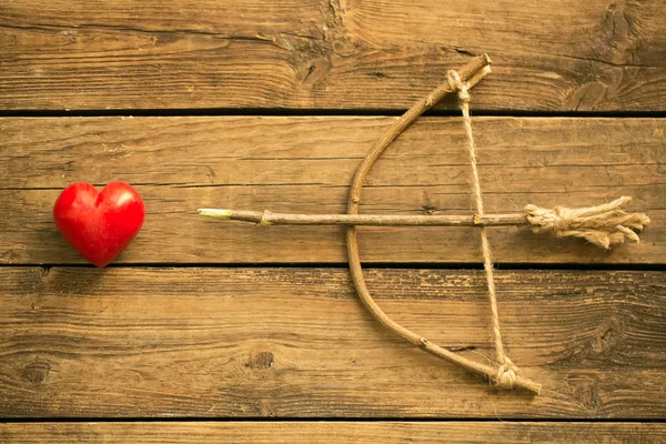 Love arrow right into the toy heart — Stock Photo, Image