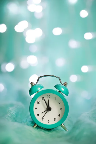 Alarm clock with Christmas lights — Stock Photo, Image
