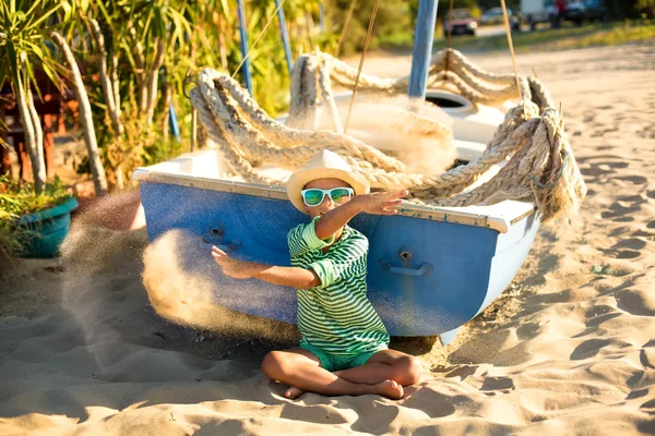 Boy relaxing on the sandy beach — Stock Photo, Image