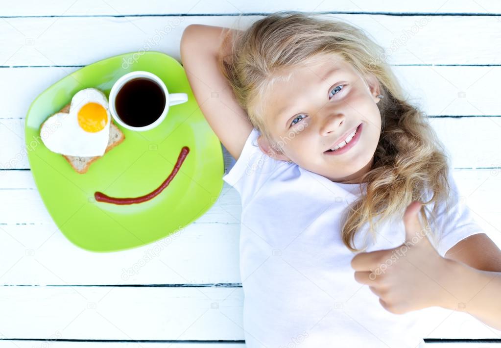 Girl and breakfast for good mood