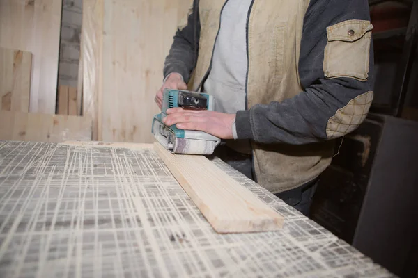 Joiner working with a manual electric sander on the desktop in production — Stock Image Joiner Working Manual Electric Sander Desktop Production Stock Picture
