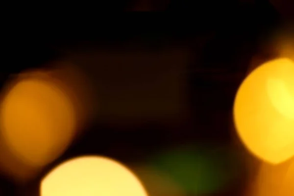 Розмитий Різдвяний Фон Абстракція Помаранчеві Жовті Гірлянди Чорному Тлі — стокове фото