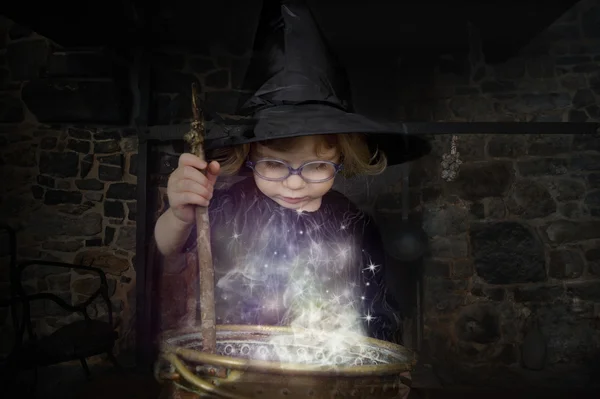 Little witch preparing a potion — Stock Photo, Image