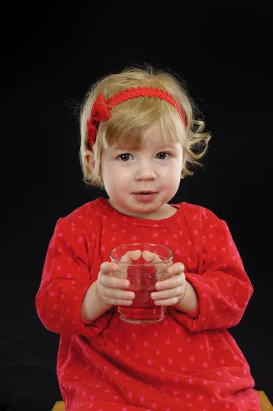 Little girl drinking juice, — Stock Photo, Image