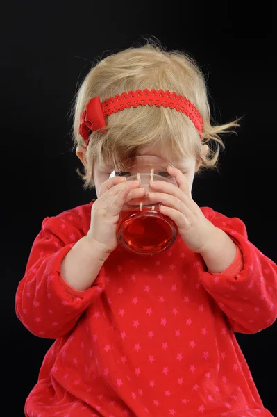 Little girl drinking juice, — Stock Photo, Image