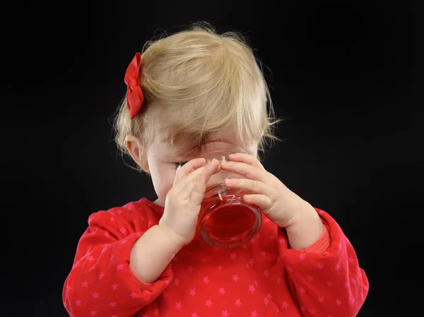 Little girl drinking juice, — Stock Photo, Image