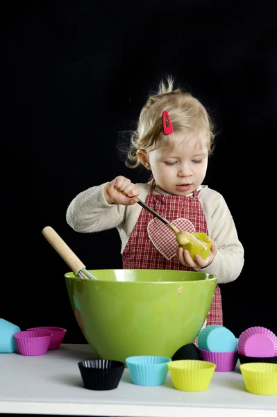 Little toddler making deserts Royalty Free Stock Photos